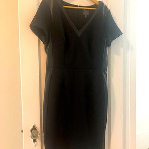 Sexy black dress with vegan leather trims. Size 14US. Perfect for any occasions